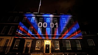 A countdown to Brexit timer and the colors of the British Union flag illuminate the exterior of 10 Downing street, in London, England, Friday, Jan. 31, 2020