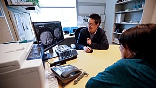 ln this  Aug. 15, 2017 photo, a patient looks at images with her doctor Shumei Kato, left, at the University of California San Diego in San Diego.