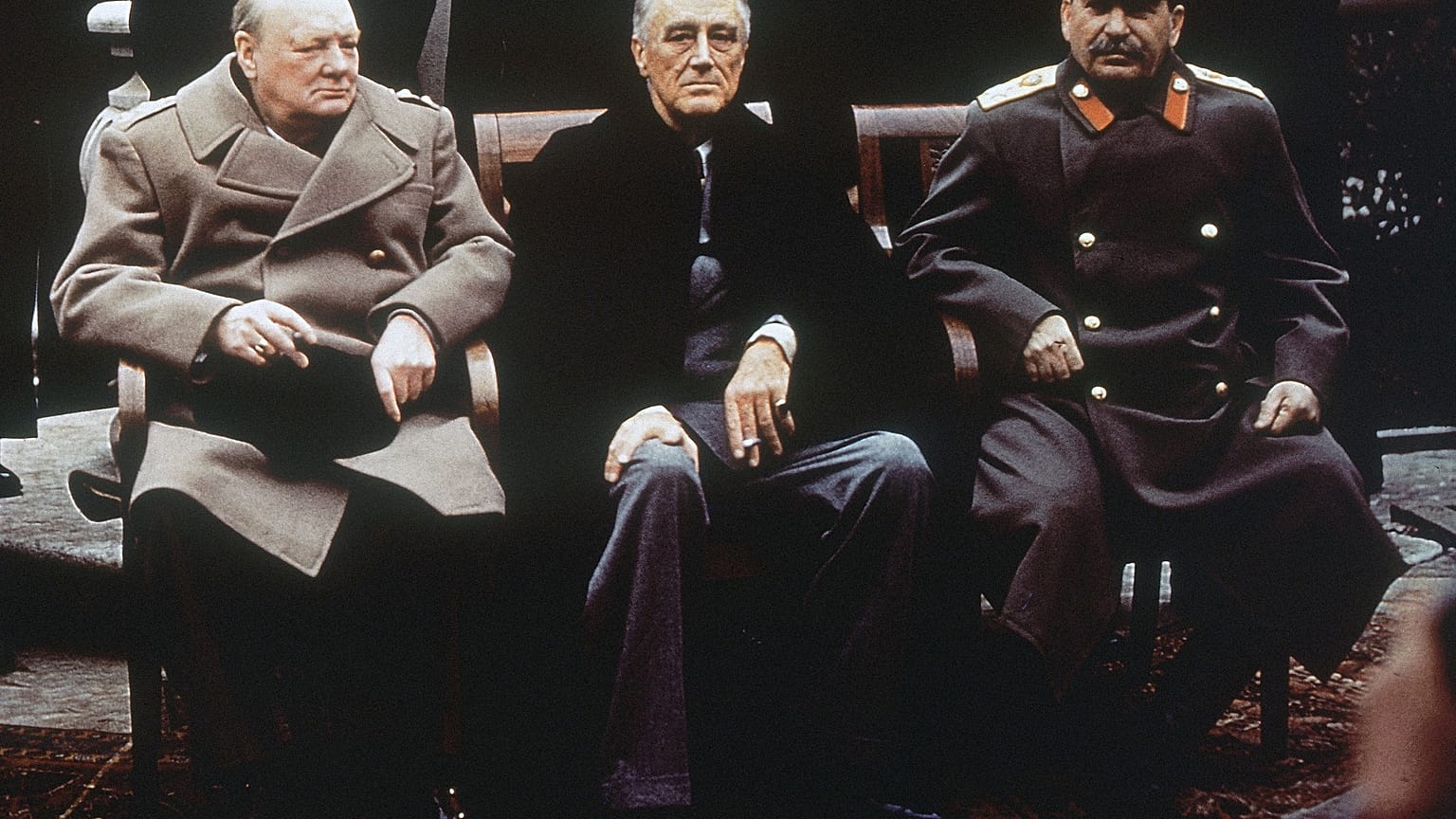Britain's Winston Churchill (L), the US' Franklin Roosevelt (C) and Soviet leader Joseph Stalin (R) on the patio of Livadia Palace, Yalta, Crimea in February 1945.