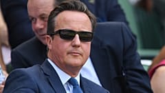 Former British Prime Minister David Cameron arrives at The All England Lawn Tennis Club in Wimbledon, southwest London, on July 6, 2018