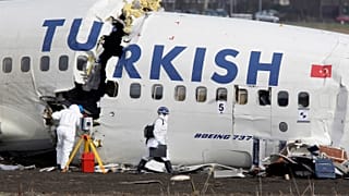 Crash investigators examine the wreckage of the Turkish airlines plane at Amsterdam's Schiphol Airport, Thursday, Feb. 26, 2009.