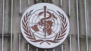 The logo of the World Health Organization (WHO) at its headquarters building in Geneva, Switzerland