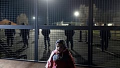 A child stands at the border line between Serbia and Hungary in Kelebija, Serbia,