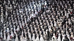 Couples attend a mass wedding ceremony organised by the Unification Church at Cheongshim Peace World Center in Gapyeong on February 7, 2020