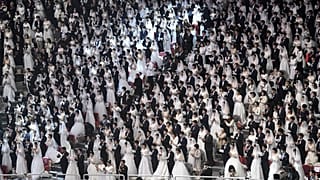 Couples attend a mass wedding ceremony organised by the Unification Church at Cheongshim Peace World Center in Gapyeong on February 7, 2020