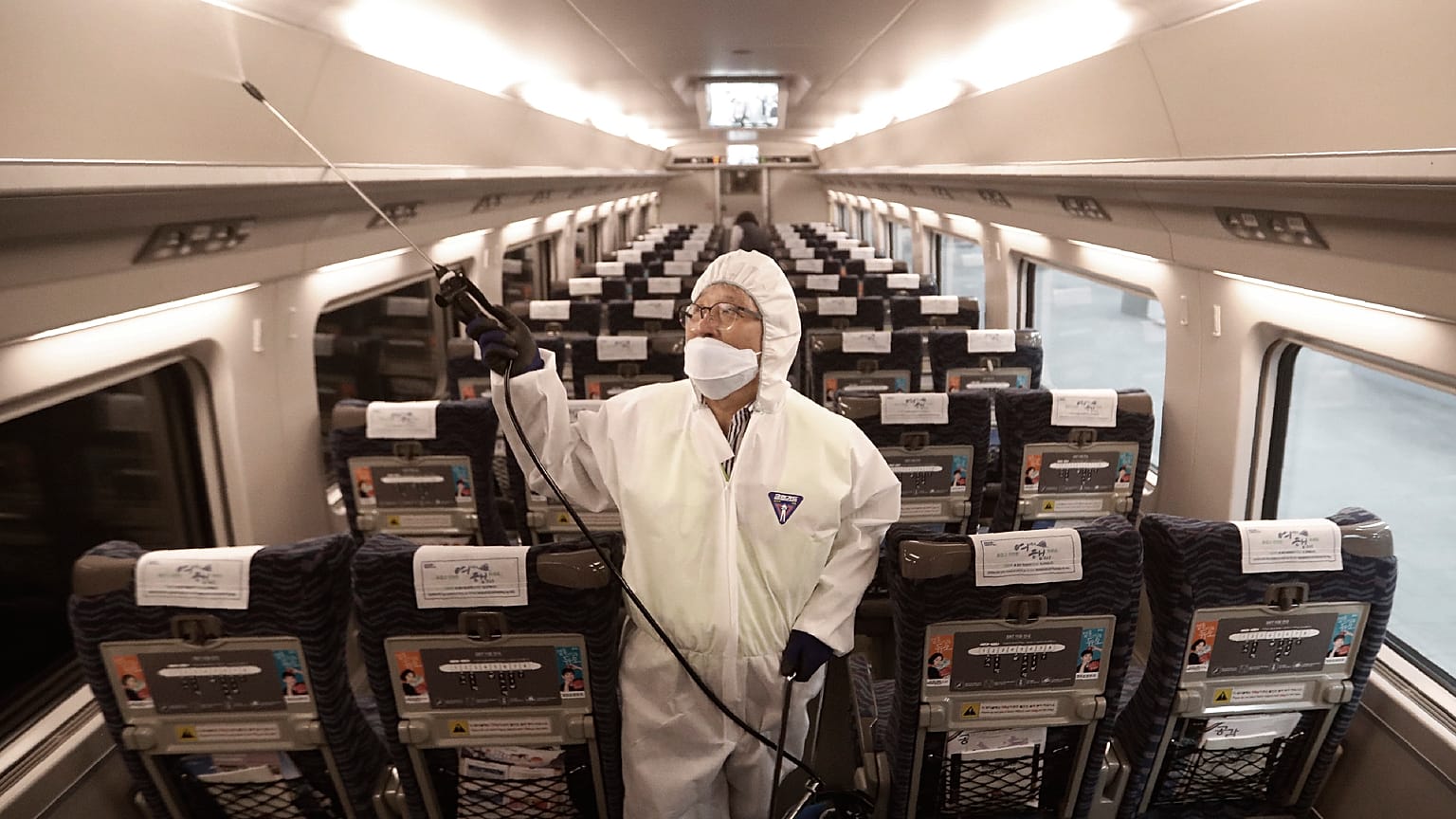 (January 24, 2020) , A train officer sprays disinfectant as a precaution against coronavirus contamination at Suseo Station in Seoul, South Korea.