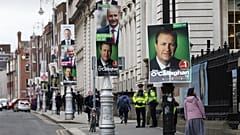 Election posters are displayed on lampposts outside the Irish Prime Minister offices in Dublin, Ireland, Friday, Feb. 7, 2020. 