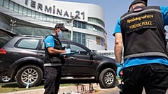Forensic officers inspect a shooting scene outside the Terminal 21 Korat mall in Nakhon Ratchasima, Thailand, Sunday, Feb. 9, 2020.