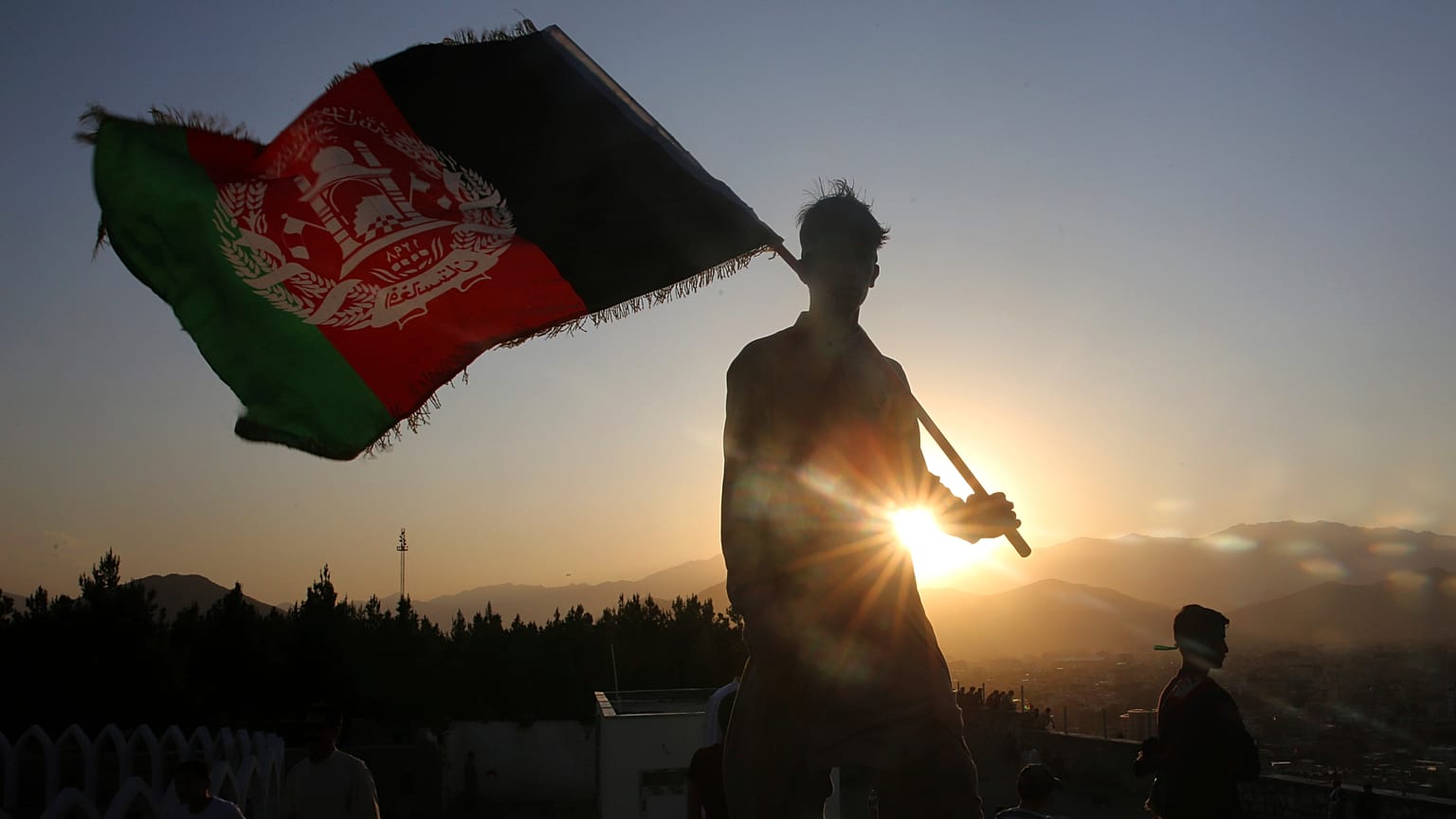 (August 19, 2019) A man waves an Afghan flag during Independence Day celebrations in Kabul, Afghanistan