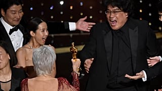 Bong Joon Ho, right, reacts as he is presented with the award for best picture for "Parasite" from presenter Jane Fonda at the Oscars on Sunday, Feb. 9, 2020.