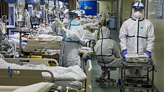 Medical workers treat patients in the isolated intensive care unit at a hospital in Wuhan in central China's Hubei province.