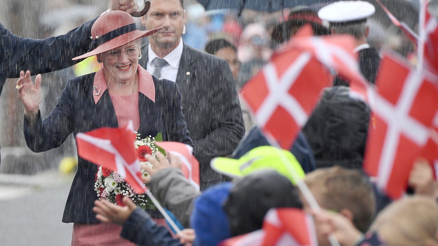 Queen Margrethe of Denmark is welcomed by students at a Danish school in Flensburg, Germany