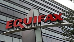 FILE- This July 21, 2012, file photo shows signage at the corporate headquarters of Equifax Inc. in Atlanta.