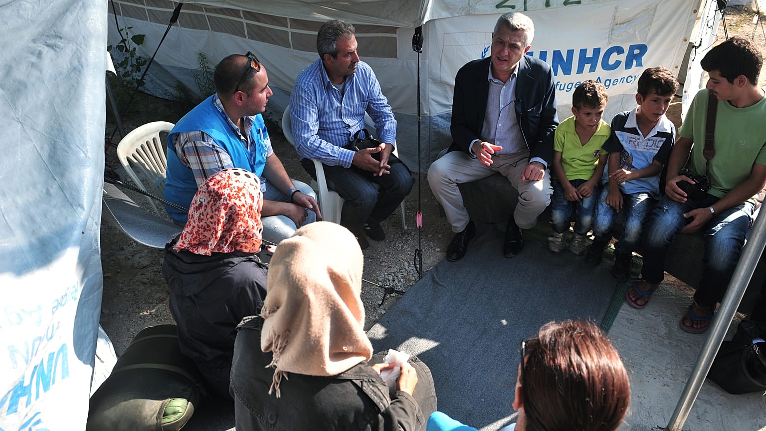 UN high commissioner for refugees Filippo Grandi speaks with Syrian refugees