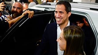 Opposition leader Juan Guaido arrives at a rally at Bolivar Plaza 