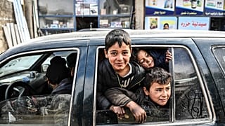 Civilians flee from Idlib toward the north to find safety inside Syria near the border with Turkey, Saturday, Feb. 15, 2020. (AP Photo) 