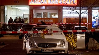 A car in front of one the two bars attacked in Hanau, Germany Thursday, Feb. 20, 2020. (AP Photo/Michael Probst)                                         
