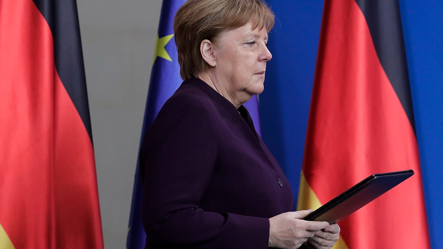German Chancellor Angela Merkel arrives for a statement at the chancellery in Berlin, Germany, Thursday, Feb. 20, 2020. 