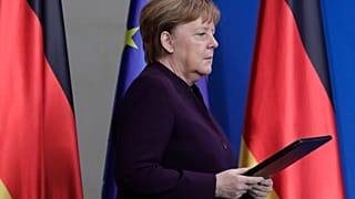 German Chancellor Angela Merkel arrives for a statement at the chancellery in Berlin, Germany, Thursday, Feb. 20, 2020. 