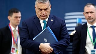 Hungarian Prime Minister Viktor Orban, center, arrives for an EU summit at the European Council building in Brussels, Friday, Feb. 21, 2020.
