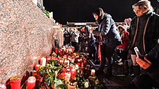 Mourners at a vigil for the victims of a shooting in Hanau