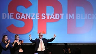 SPD top candidate and First Mayor of Hamburg Peter Tschentscher celebrates with supporters after exit polls for the Hamburg state elections announced on Feb. 23, 2020.