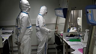 Scientists testing for COVID-19 in France