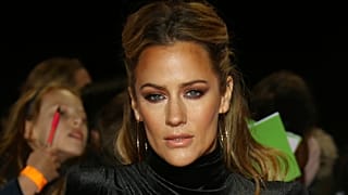 Caroline Flack poses for photographers upon arrival for the Pride of Britain Awards at a central London hotel, Monday, Oct. 29, 2018
