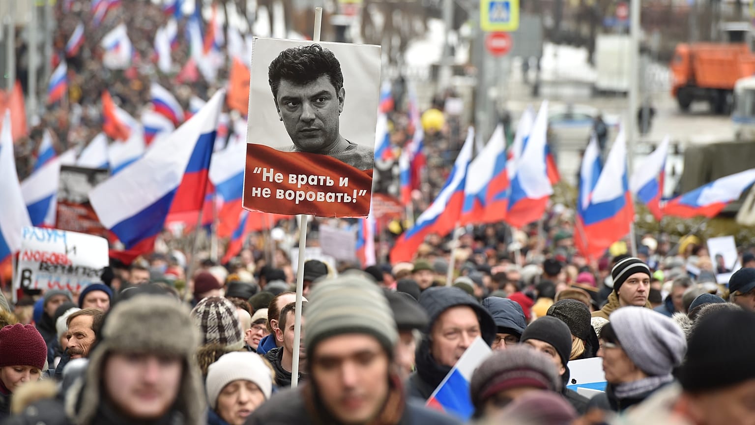 Demonstrators march in memory of opposition leader Boris Nemtsov in Moscow, Russia, Sunday, Feb. 24, 2019.