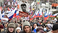 Demonstrators march in memory of opposition leader Boris Nemtsov in Moscow, Russia, Sunday, Feb. 24, 2019.