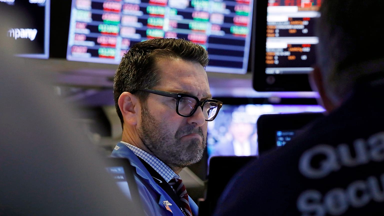 Trader Leon Montana works on the floor of the New York Stock Exchange, Friday, Feb. 28, 2020.