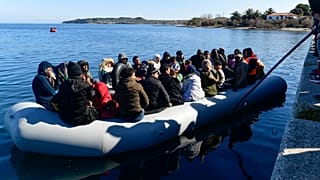 Local residents prevent migrants from reaching the small port of Thermi, on the Greek island of Lesbos.