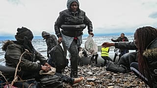 Migrants arrive in Lesbos after Erdogan opens Turkey's border with EU