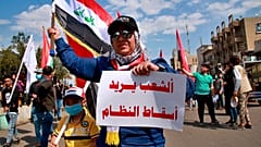 متظاهرو العراق لا يخشون كورونا ويعتبرون أن السياسيين هم "الفيروس الحقيقي"