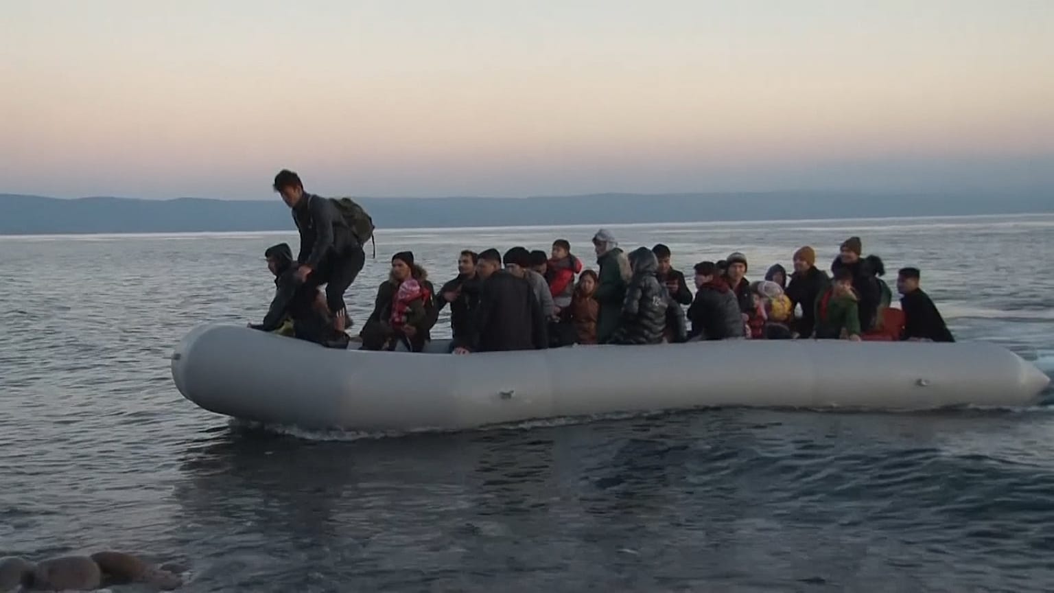 Migrants arrive on Lesbos with others blocked at land border