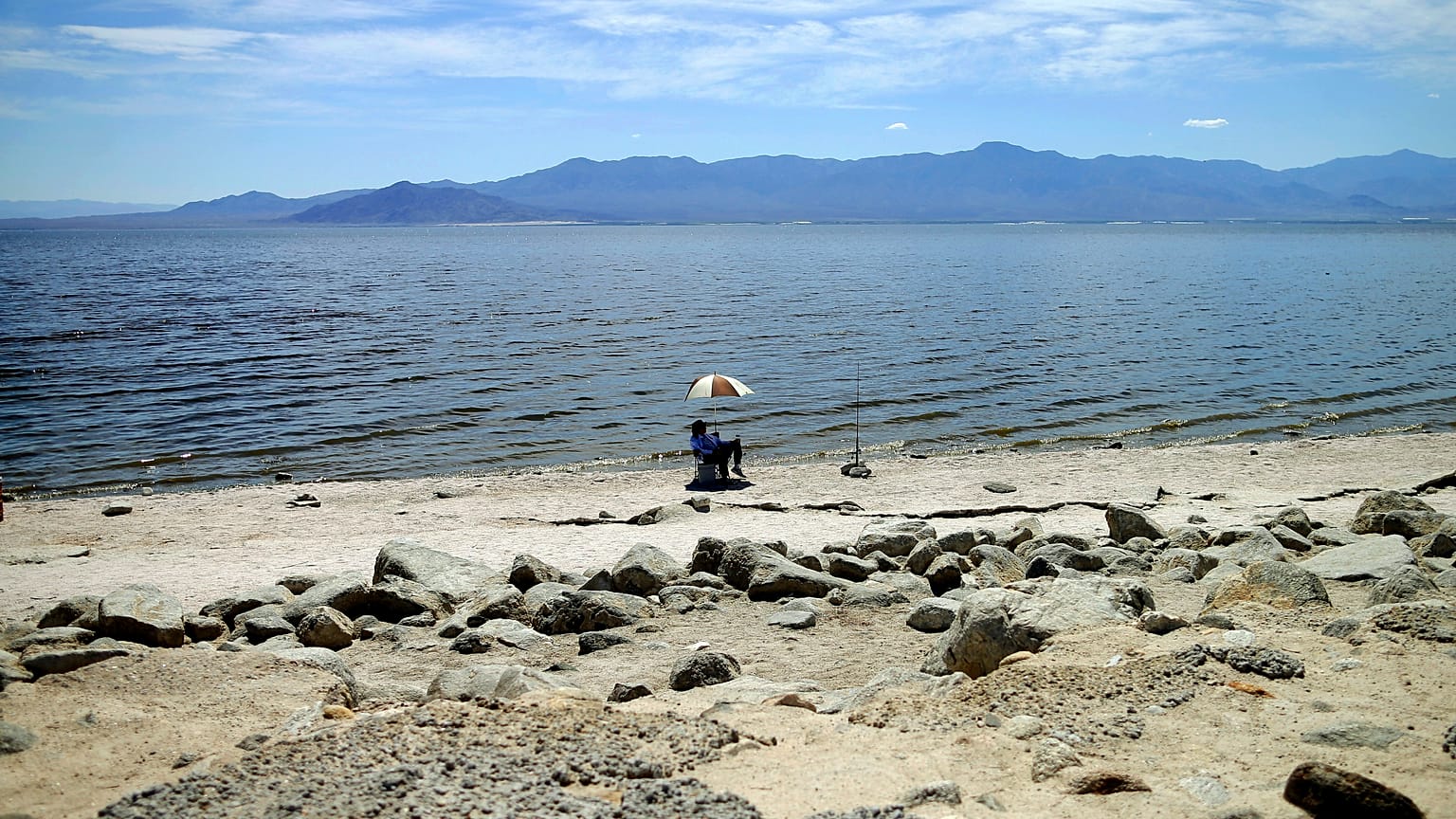 A man fishes along the receding banks of the Salton Sea near Bombay Beach, California, USA; in April 30; 2015.