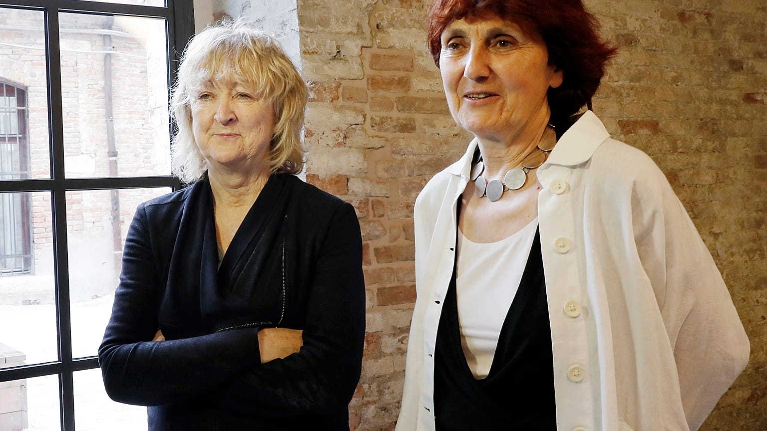 In this May 23, 2018 file photo, Biennale International Architecture exhibition curators Yvonne Farrell, left, and Shelley McNamara appear in Venice, Italy. 