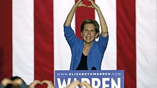 Massachusetts Senator Elizabeth Warren makes the shape of a heart