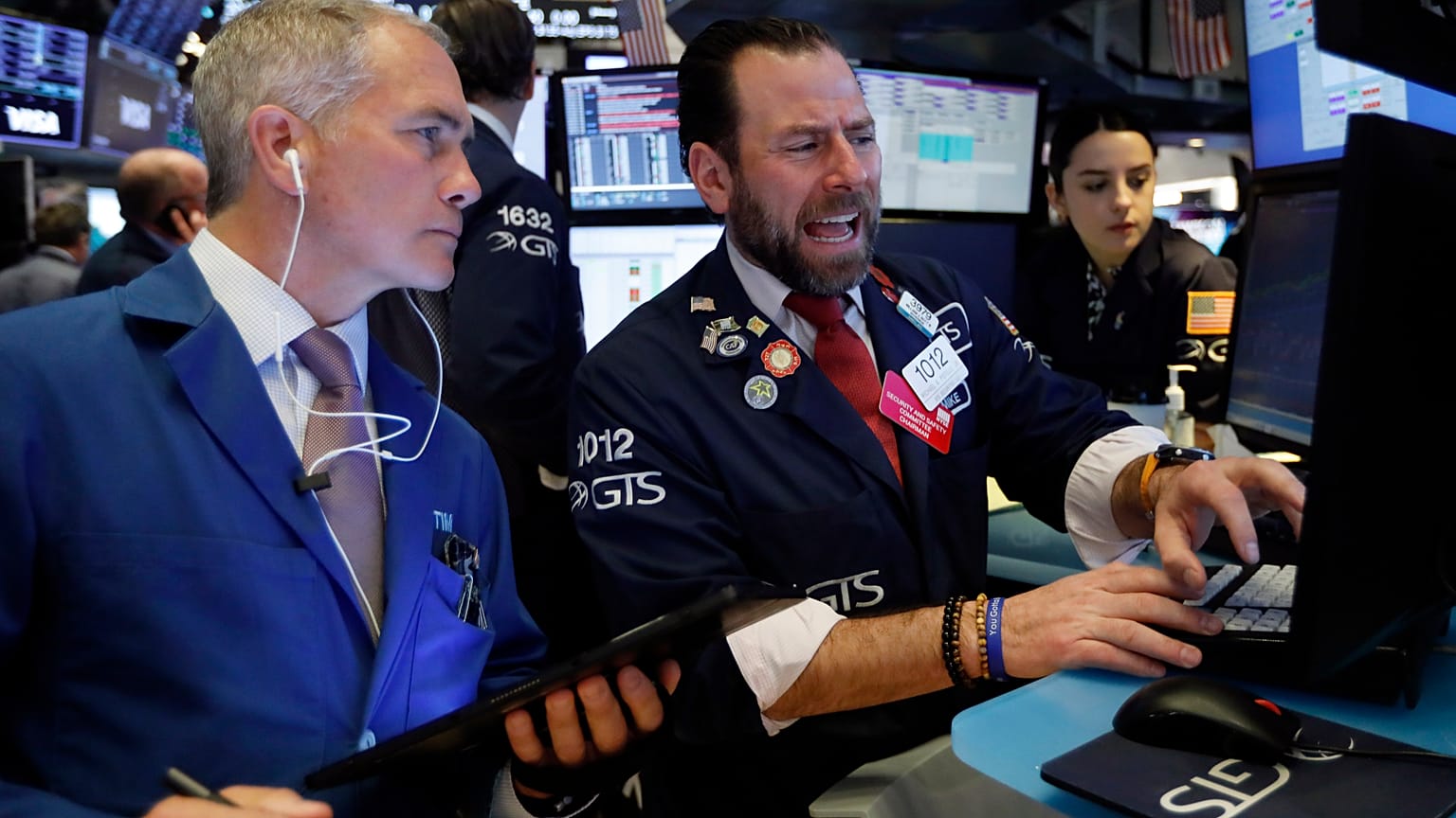 Traders work on the floor of the New York Stock Exchange, March 3, 2020.