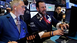 Traders work on the floor of the New York Stock Exchange, March 3, 2020.