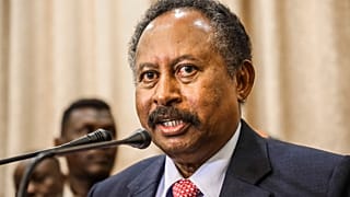 In this Aug. 21, 2019, file photo, Sudan's new Prime Minister Abdalla Hamdok speaks during a press conference in Khartoum, Sudan. 