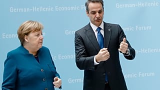 German Chancellor Angela Merkel, left, and the Prime Minister of Greece, Kyriakos Mitsotakis, right