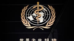 A picture taken on March 9, 2020 shows the sign of the World Health Organization