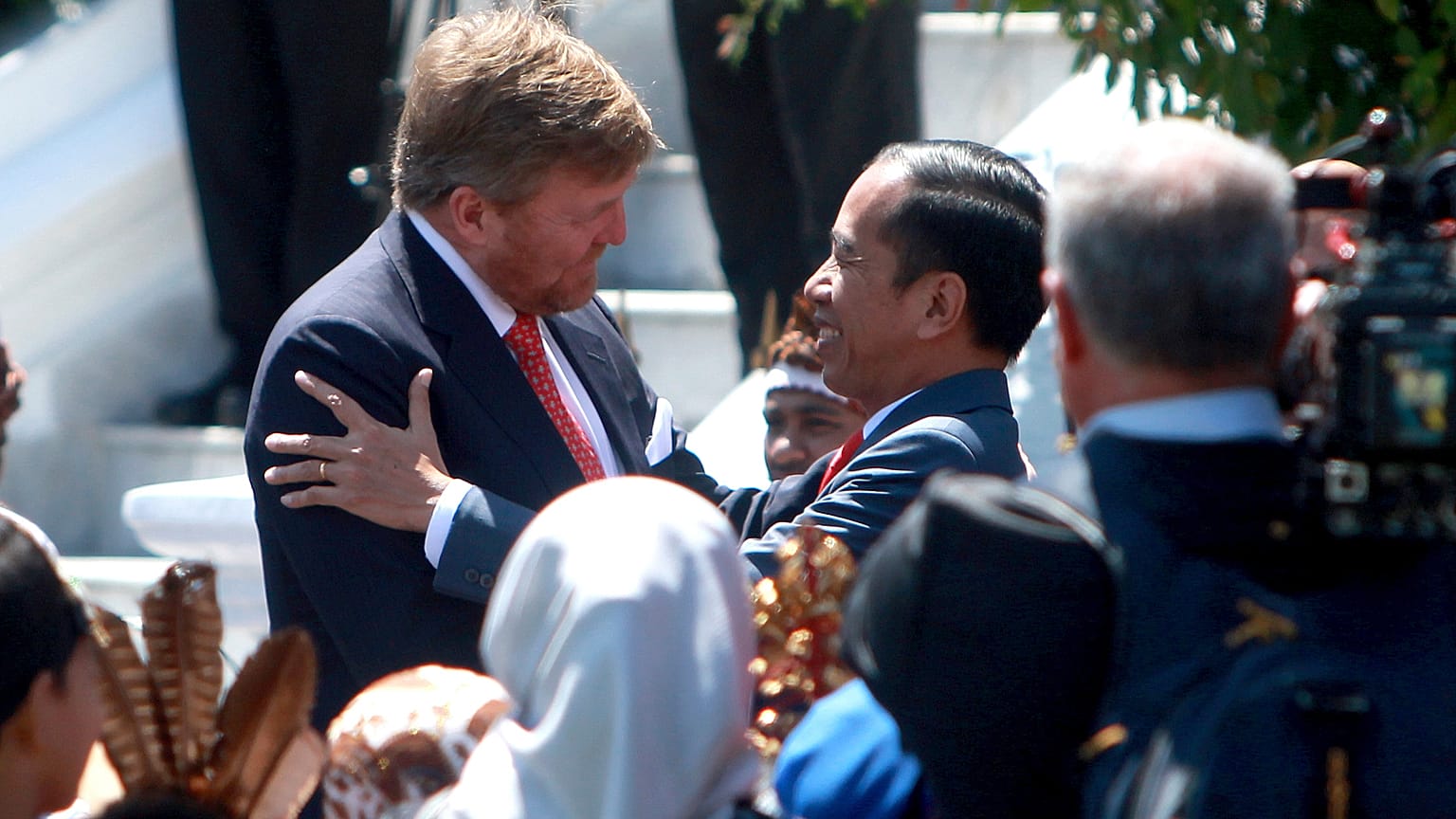 King Willem-Alexander of the Netherlands is welcomed by Indonesian President Joko Widodo on his arrival at the presidential palace in Bogor. 