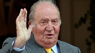 Spain's former King Juan Carlos waves
