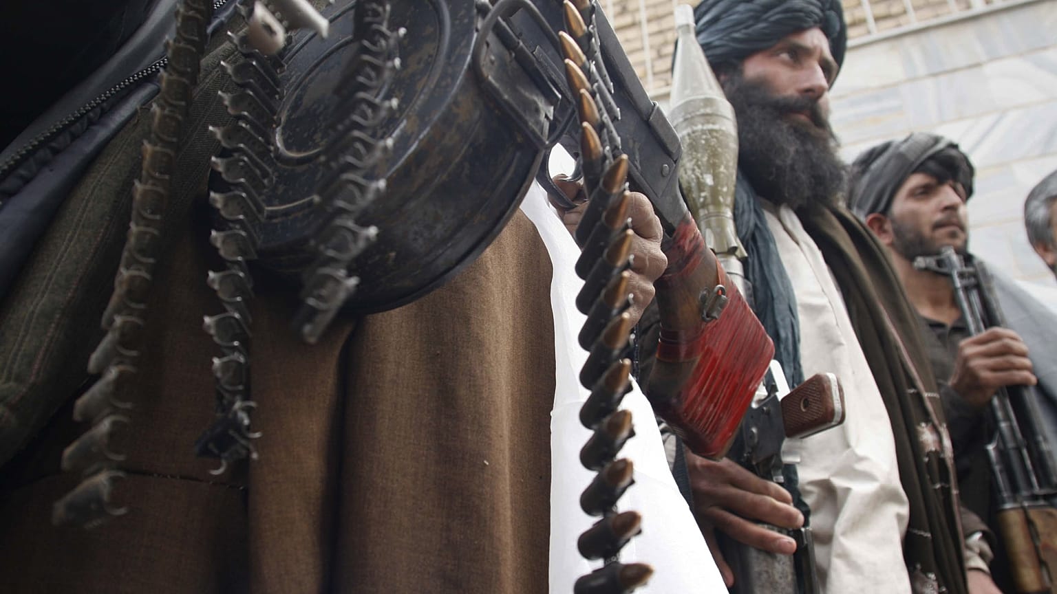 Former Taliban militants hold their heavy and light weapons Herat province west of Kabul, Afghanistan, March 10, 2009.