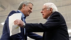New York Mayor Bill de Blasio greets Democratic presidential candidate Sen. Bernie Sanders, after introducing him at a campaign event in Carson City, Nev.