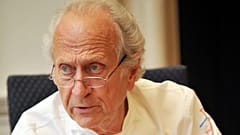 French chef Michel Roux speaks to other judges during the finals of the 'Roux Scholarship' competition at the Mandarin Oriental hotel in central London, on April 6, 2009. 