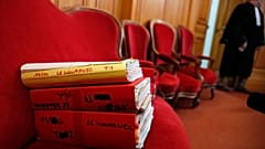The judiciary files of retired French surgeon Joel Le Scouarnec are displayed on the opening day of his trial in the courthouse of Saintes