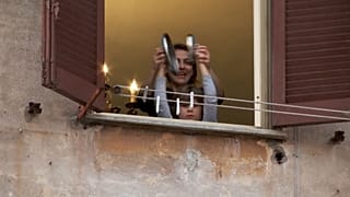 Italians sing, clap, vow to remain united on virus